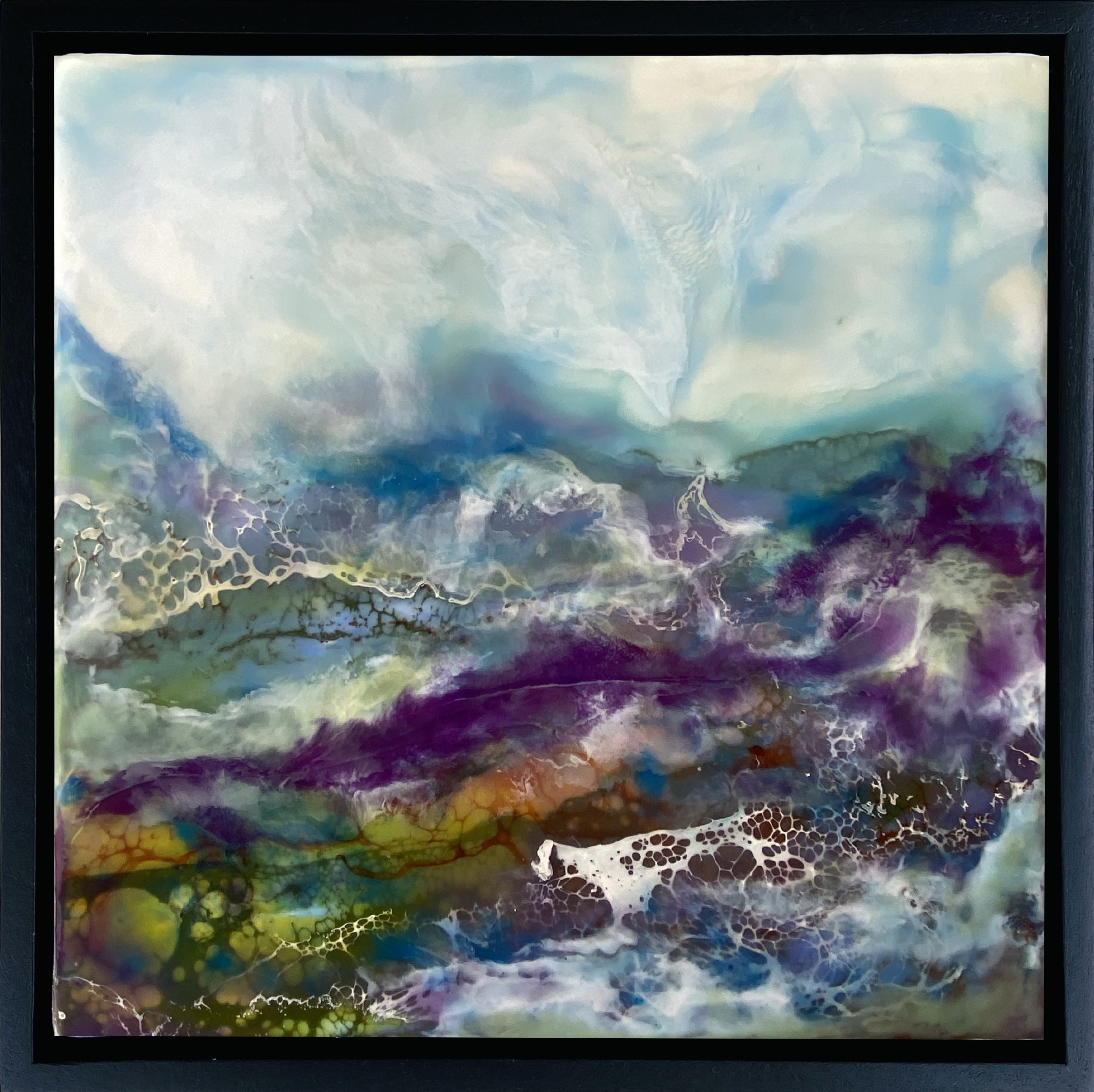 A striking violet streak weaves through an encaustic painting, adding depth and intrigue to the overall design. Shades of blue and white dance together in the sky, forming a celestial display that captivates the imagination. Title: Majesty